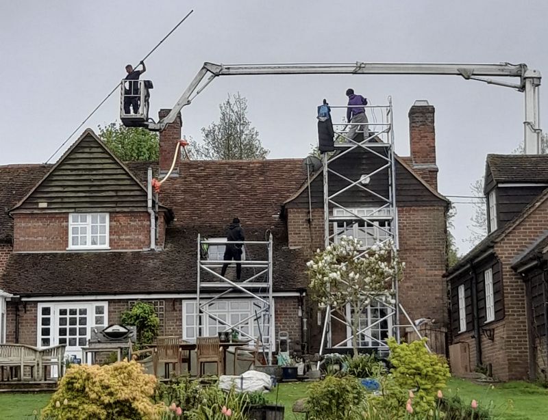 The Roof Moss Cleaners using cherry picker and scaffolding to clean roof safely and professionally in Potters Bar, Hertfordshire