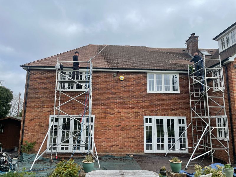 Roof cleaning carried out safely from scaffold towers by The Roof Moss Cleaners in Potters Bar